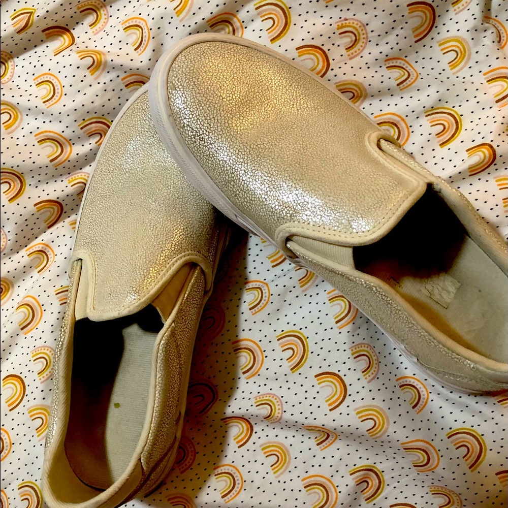 White opalescent slip on Vans shoes
